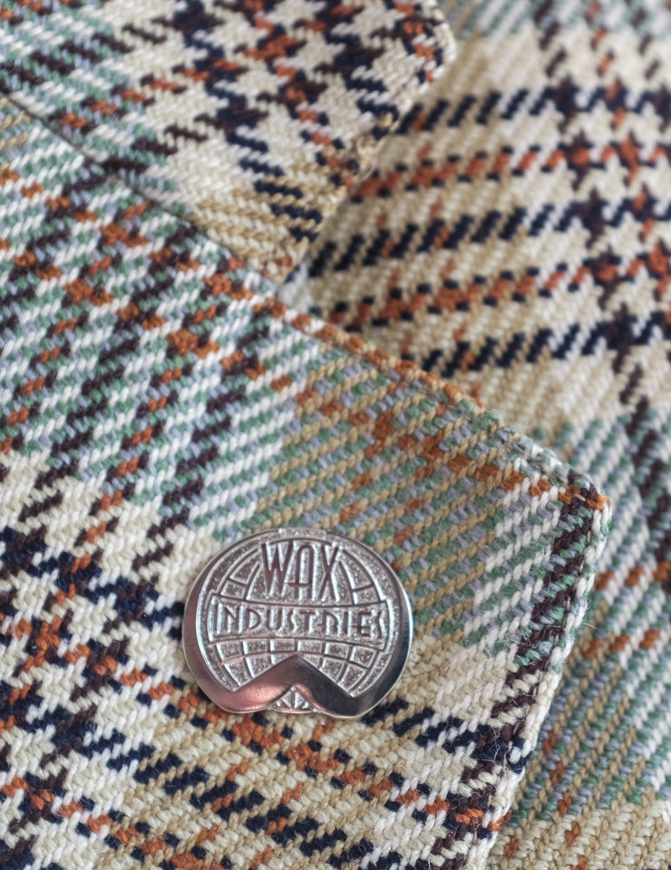 Wax Industries Lapel Badge